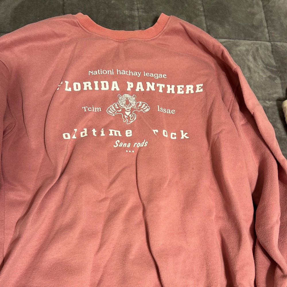 hockey crewneck pinkish salmon colored